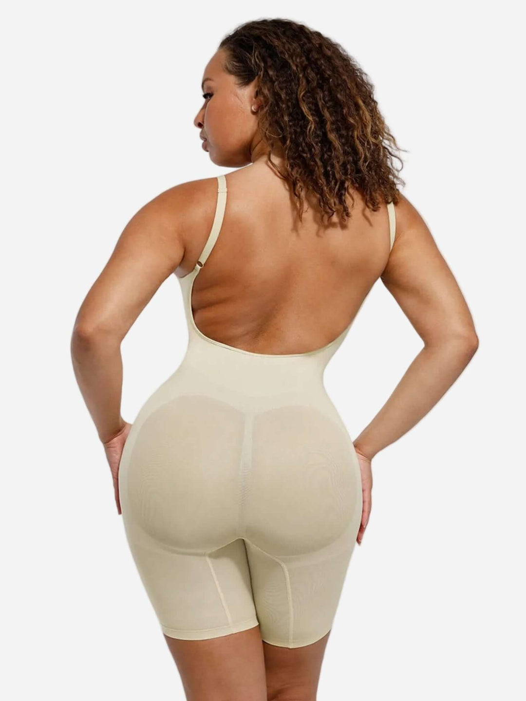 open-back sculptwear bodysuit with front-scoop neckline, medium compression, and mid-thigh length for a smooth, contoured look