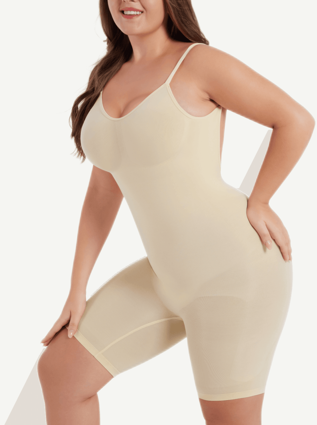open-back sculptwear bodysuit with front-scoop neckline, medium compression, and mid-thigh length for a smooth contoured fit