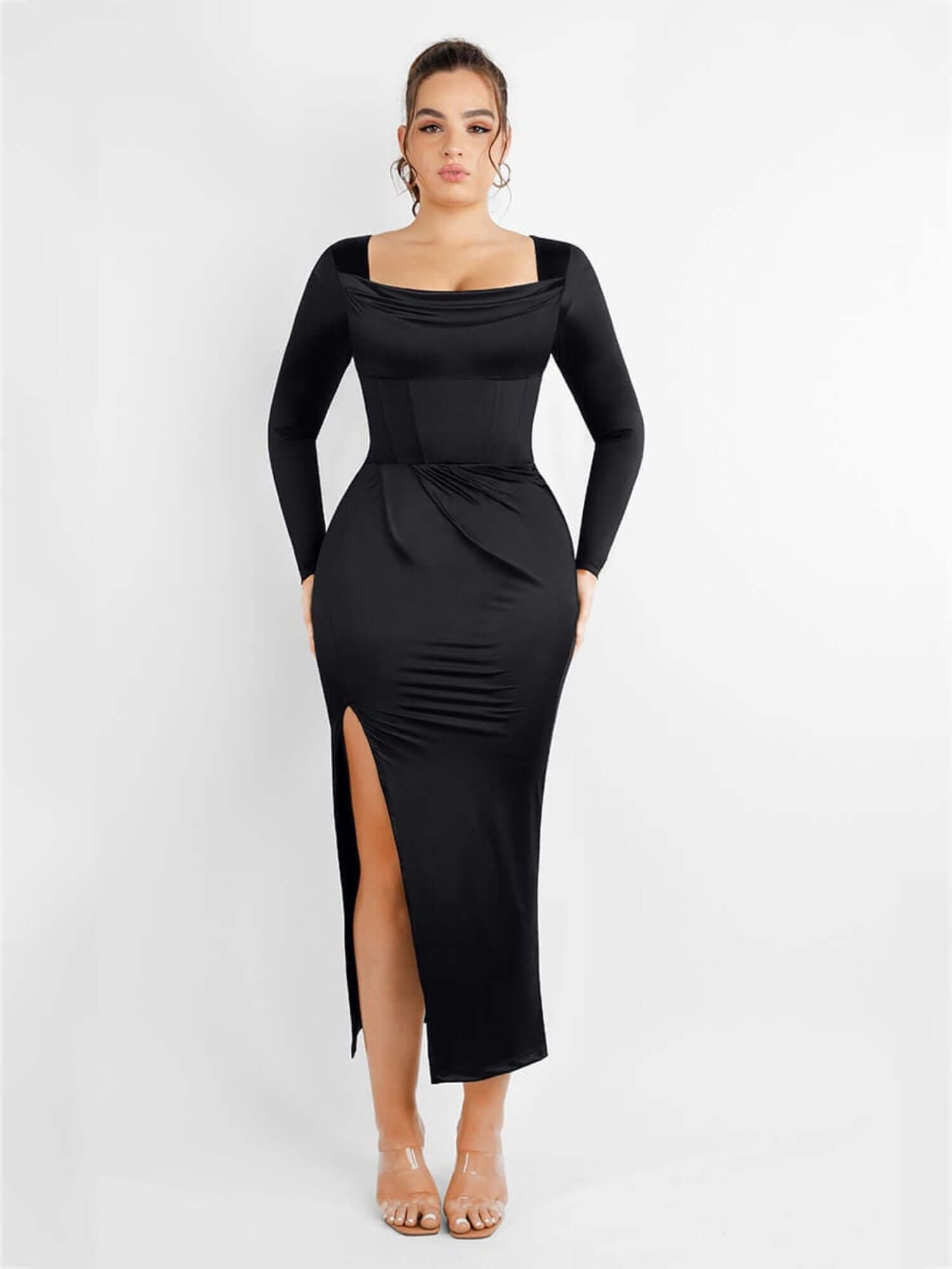 Black corset bodysuit dress with square neckline, long sleeves, thigh-high slit, and waist-sculpting fit for a sleek retro look