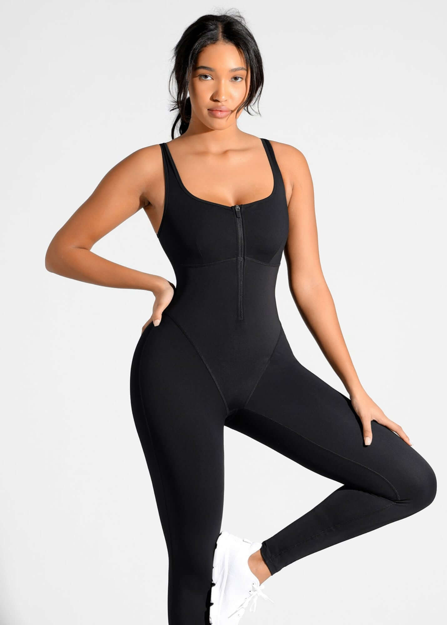 Black sauna workout jumpsuit with zip front, waist support, and stretchy fit for women’s training and sweat-inducing workouts