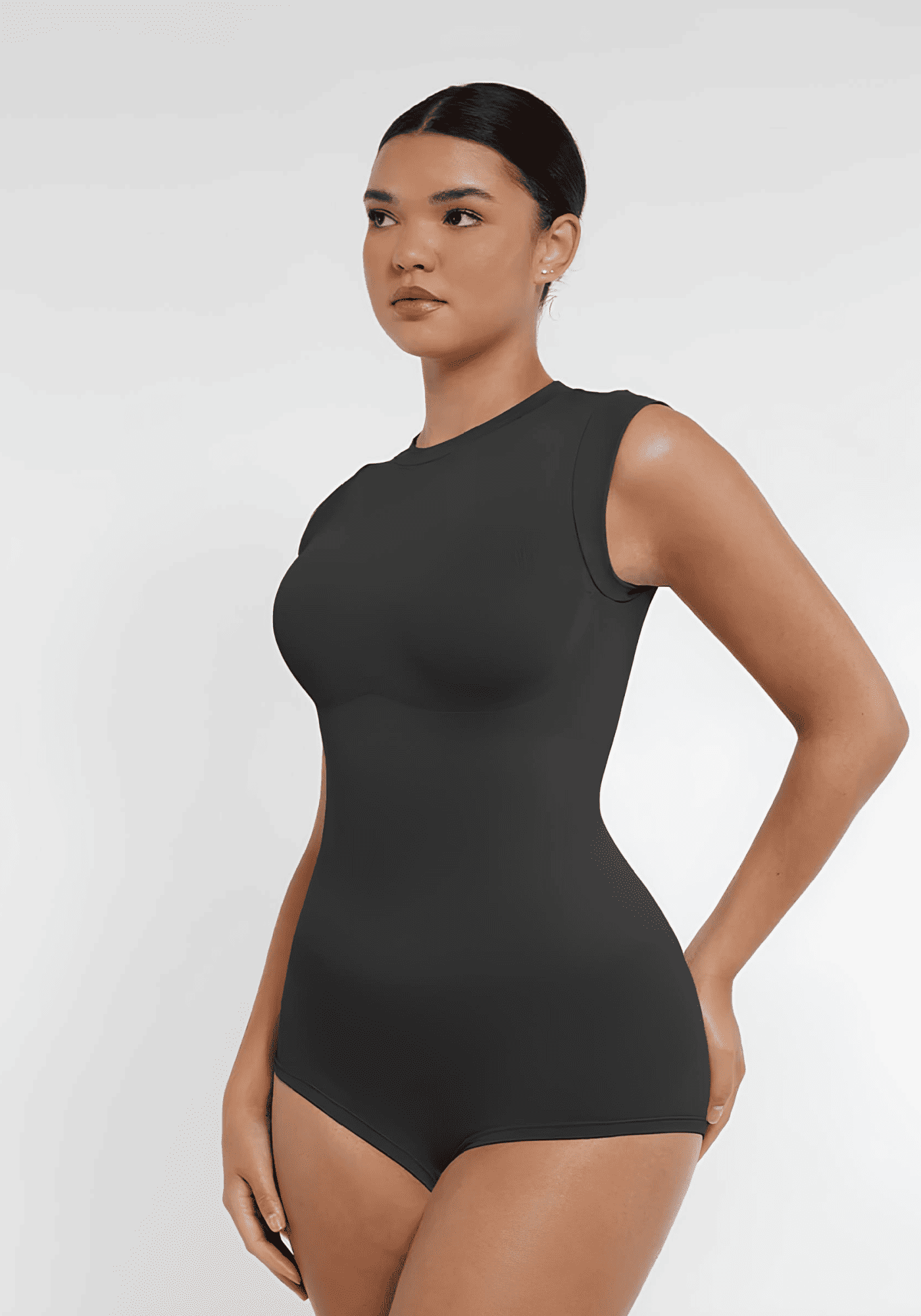 seamless shaping bodysuit with high neck, cap sleeves, and waist-sculpting fit for a sleek, confident silhouette
