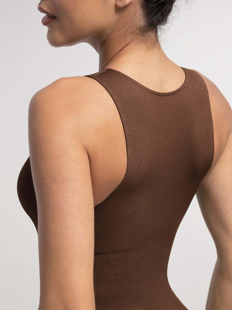 Brown ribbed tank top worn by a person on a light gray background