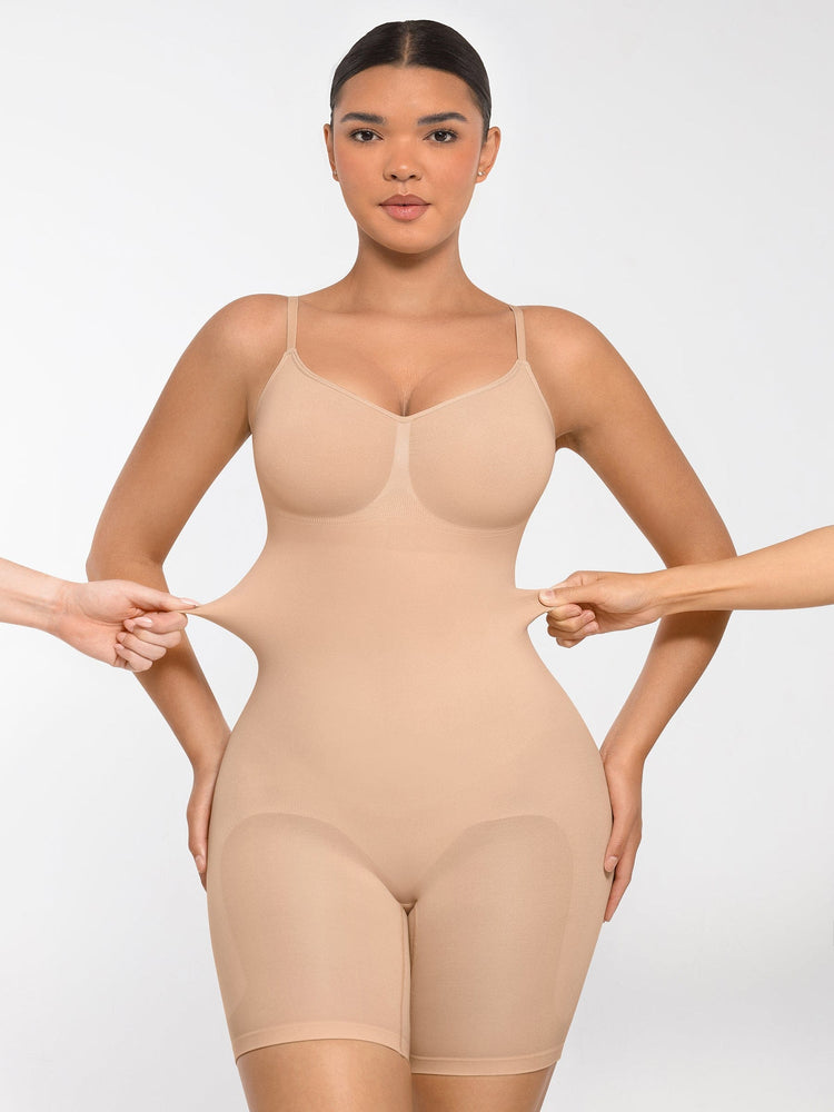 Woman wearing a beige shapewear garment against a white background