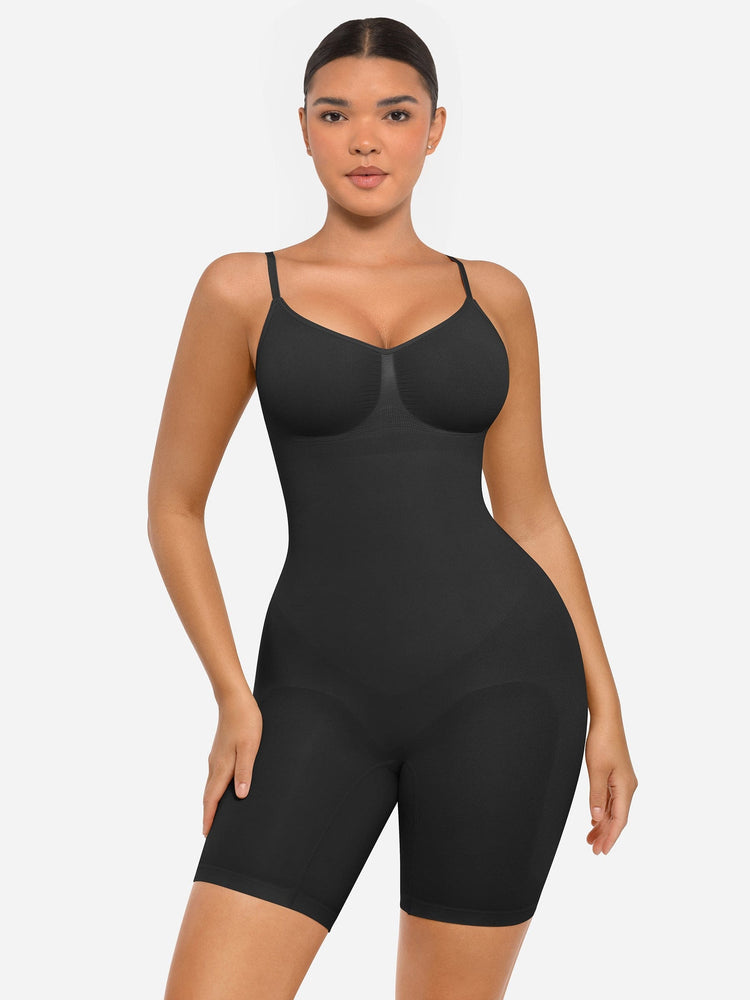 Woman wearing a black shapewear bodysuit on a white background