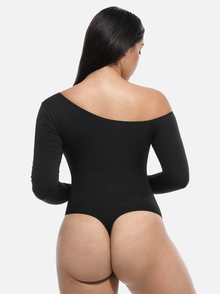Person wearing a black bodysuit on a white background
