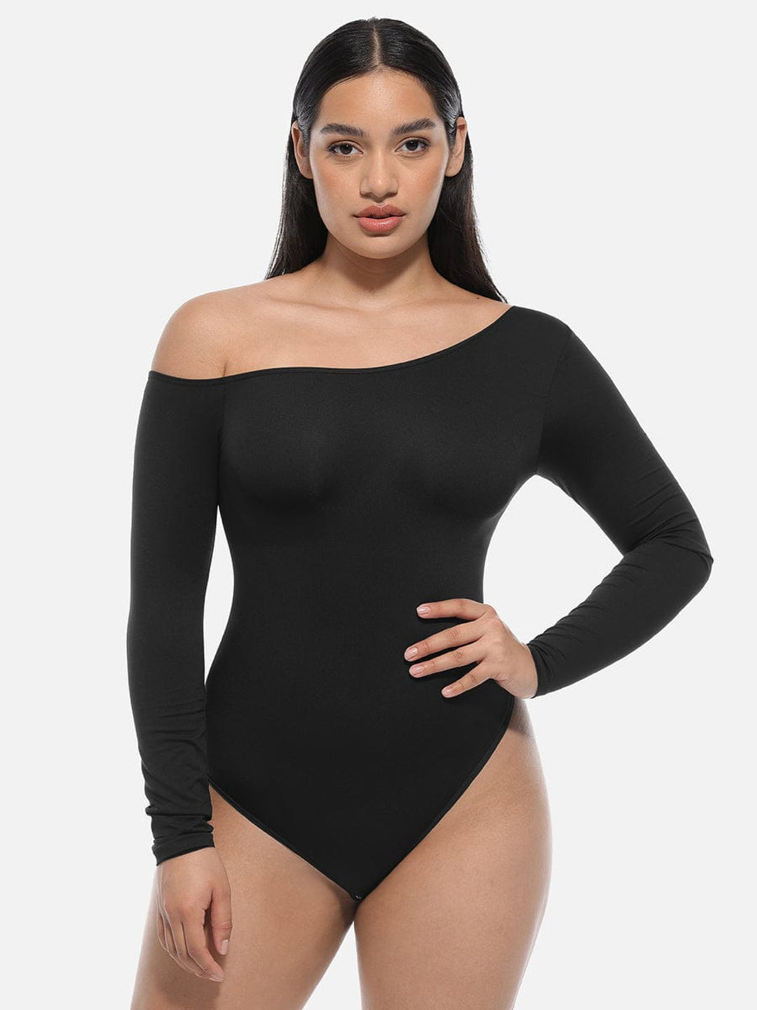 Woman wearing a black off-shoulder bodysuit on a white background