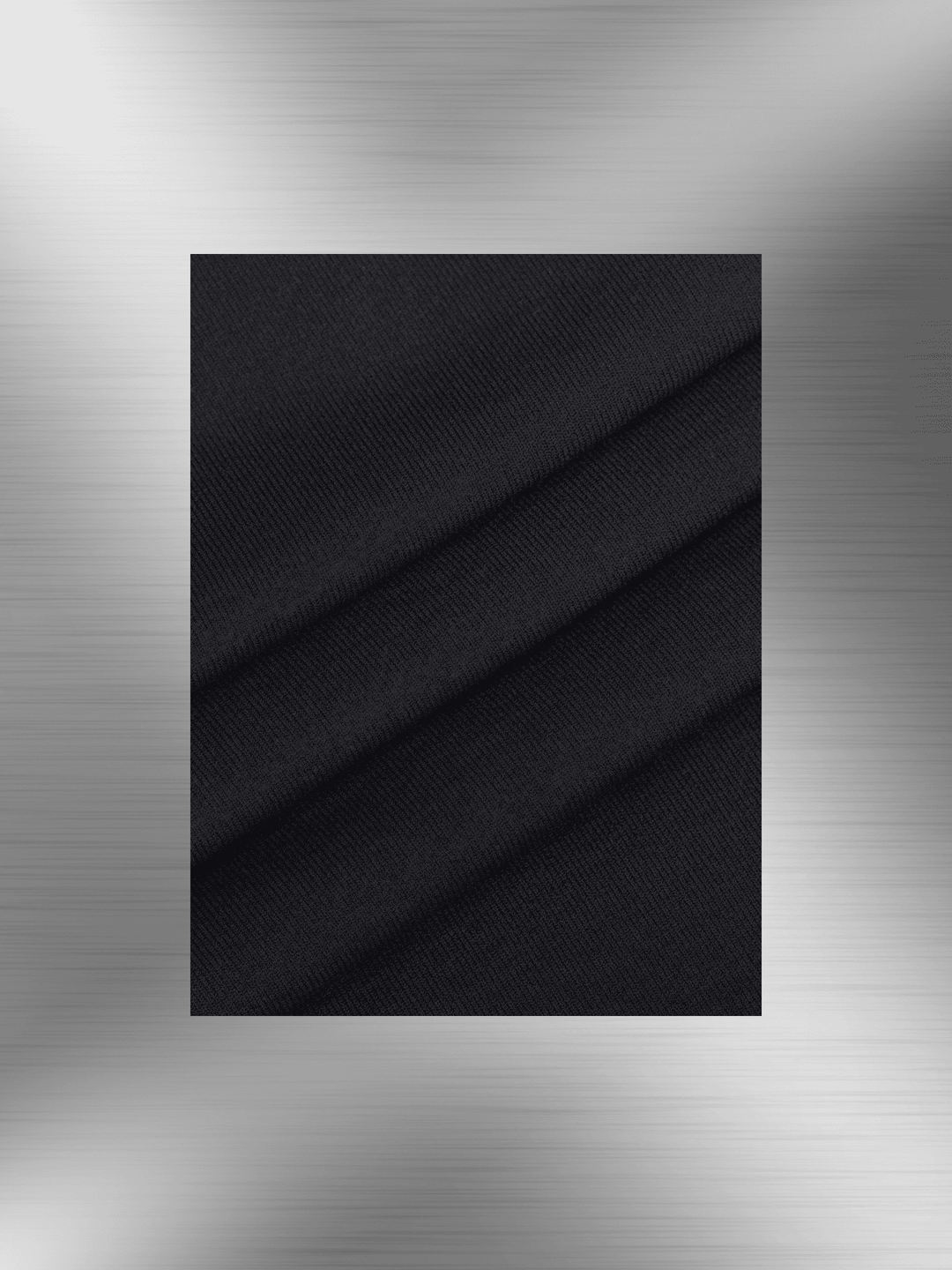 Black textured fabric close-up for shaping dress with bust support, showing soft seamless material and elegant drape.