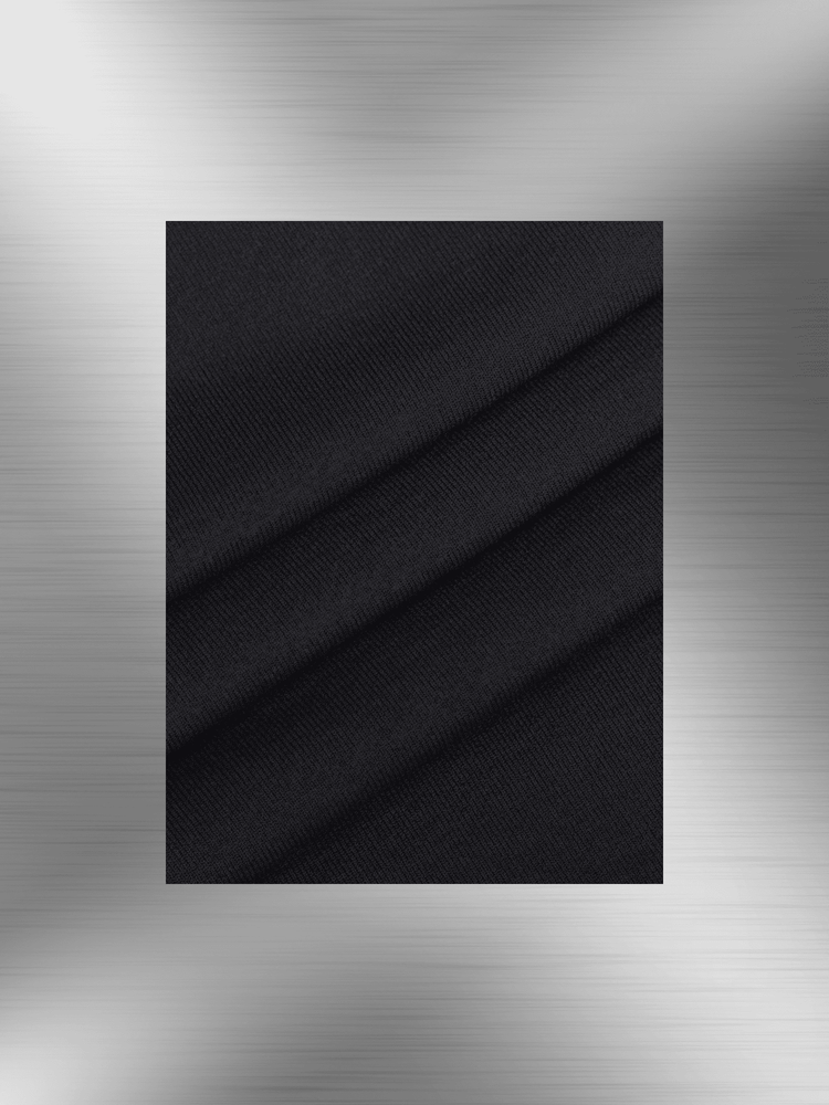 Black textured fabric close-up for shaping dress with bust support, showing soft seamless material and elegant drape.