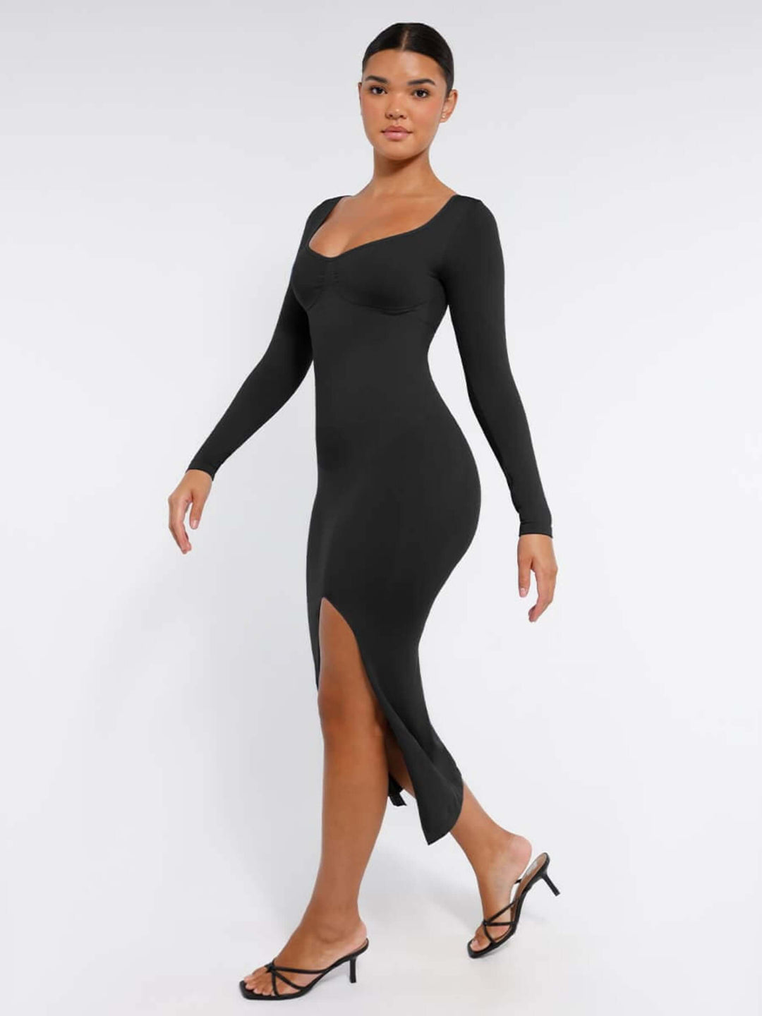 Black shaping dress with bust support featuring long sleeves, high side slit, and sleek body-sculpting fit