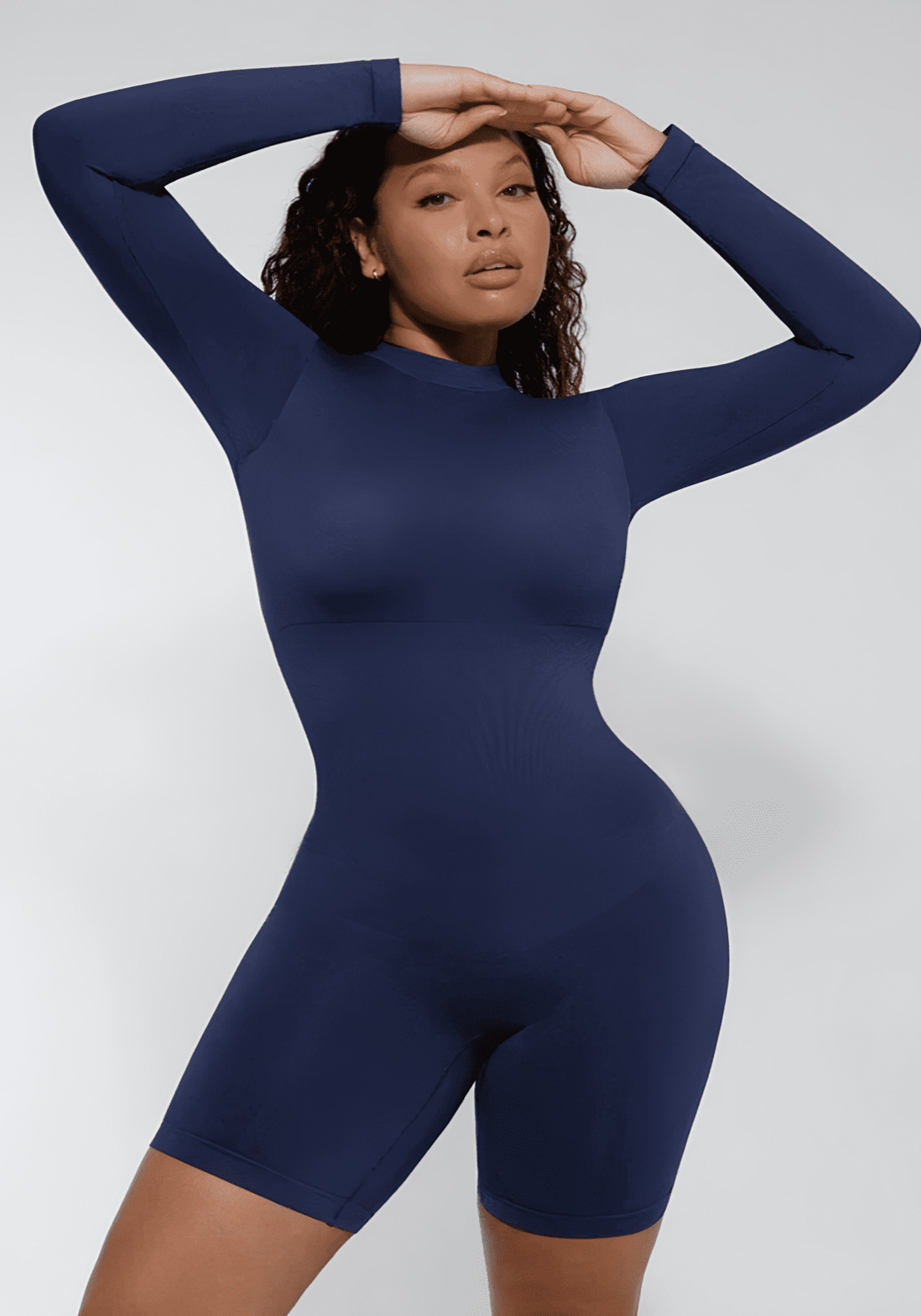 tummy control bust support jumpsuit, navy seamless body-hugging shapewear with long sleeves and sleek fit