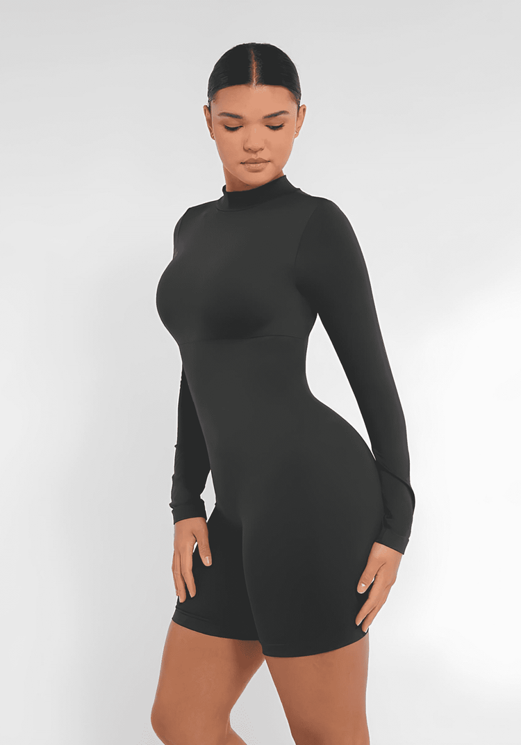 Black tummy control bust support jumpsuit with semi-high collar, seamless fit, and shaping waist for sleek comfort